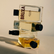 4 stacked bottles of BRUXA Body Oil of Summer 100ml