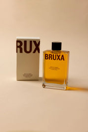 a bottle of BRUXA Body Oil of Winter 100ml and its box packaging
