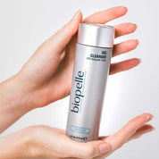 Caucasian woman's hands holding Biopelle® Exfoliating Gel Cleanser